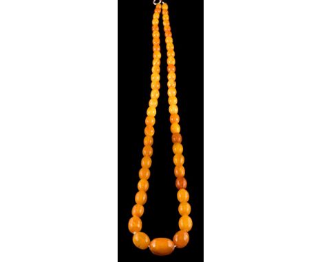 A graduated amber bead single-string necklace: with 55 oblong beads graduating from 9mm long to 21mm long on bolt ring clasp,
