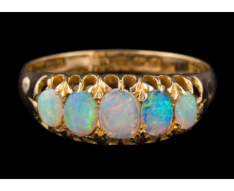 An 18ct gold and opal five-stone ring: set with graduated oval opals, the shank with Birmingham assay marks, ring size R 1/2.