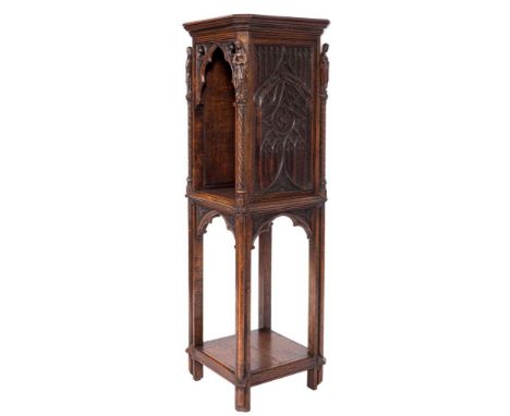 A Victorian Gothic carved oak square open pedestal cabinet:, the top with cut corners, the Gothic and trefoil arched open com