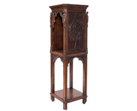 A Victorian Gothic carved oak square open pedestal cabinet:, the top with cut corners, the Gothic and trefoil arched open com