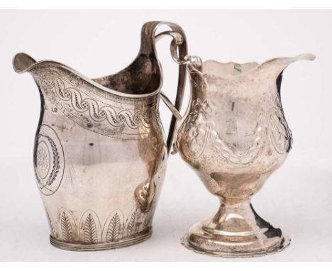 A silver cream jug, maker R?, marks worn: monogrammed, with engraved foliate decoration, raised on an oval fluted foot, 11cm.