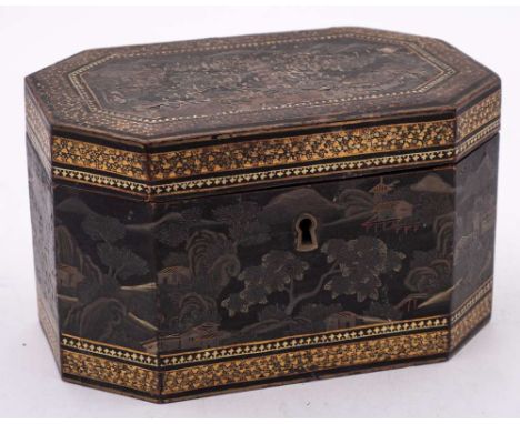 An  19th Century Chinese export ware tea caddy: of rectangular outline and canted corners, the hinged lid enclosing two pewte