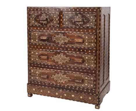 An Indian hardwood, ivory and ebony marquetry rectangular chest:, with geometric lozenge panels and spandrels decorated with 