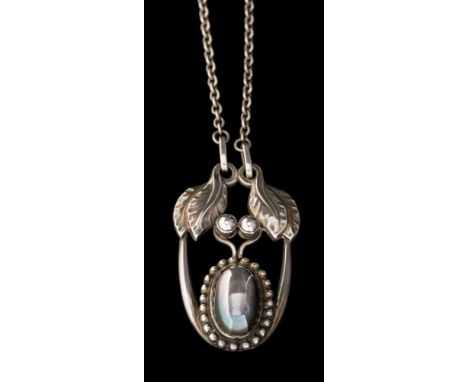 Georg Jensen. A silver pendant necklace design number 4: the pendant with oval cabochon of beaded surround beneath leaf desig