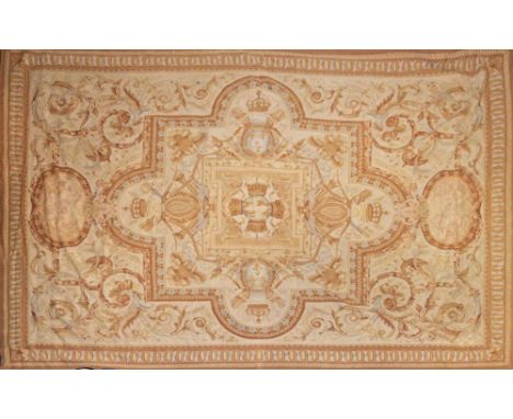 An Aubusson tapestry:, the beige field with a central panel of broken square outline with sphere and surrounding crown motif,