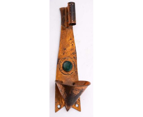 An Arts & Crafts period copper wall light: the shaped and tapering backplate with coned chimney, pottery roundel and candle h