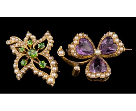 A late 19th / early 20th Century gold, seed-pearl and demantoid garnet leaf brooch: approximately 29mm long and an amethyst a