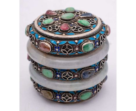 A Chinese jade, hardstone and enamel mounted silver box and cover: set with two jade bangles and semi-precious cabochons on a