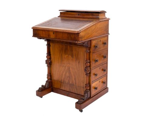 A Victorian walnut and inlaid Davenport:, bordered with lines, the superstructure with a domed lidded fitted stationery compa