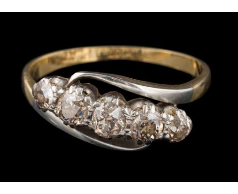A diamond mounted five-stone cross-over ring: set with round old brilliant-cut diamonds estimated to weigh a total of 0.70ct,