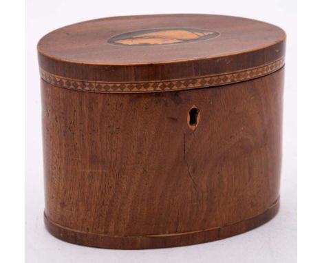 An 18th Century mahogany and inlaid oval tea caddy: the hinged lid with inlaid conch shell medallion, enclosing two compartme