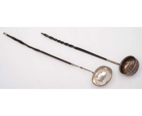A late 18th Century silver toddy ladle, maker W.W,: of ovoid form with crinkle edge border, mounted on a whalebone handle, 37