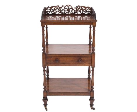 A Victorian rosewood rectangular three tier whatnot:, with a pierced fret foliate three quarter gallery, fitted with a centra