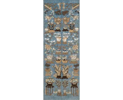 A pair of Chinese mandarin's sleeves: embroidered in silk and metal thread with auspicious objects, bats and floral sprays on