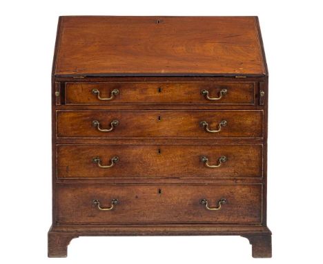 A George III mahogany bureau:, the sloping hinged fall enclosing a fitted interior with chequer inlaid small drawers and pige