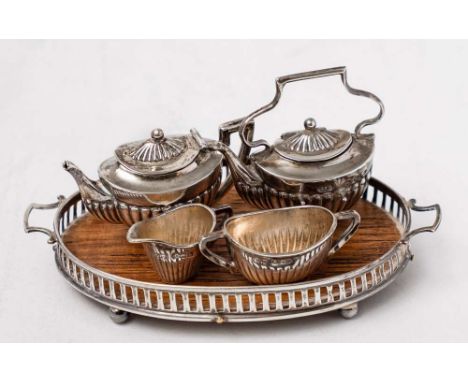An Edward VII miniature silver tea service, with serving tray, maker Levi &amp; Salaman, Birmingham, 1905/07: includes teapot