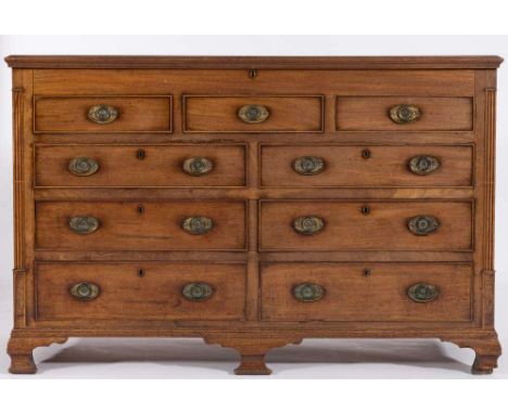 A George IV mahogany mule chest:, the hinged top with a moulded edge, having a dummy drawer upper part and four short drawers