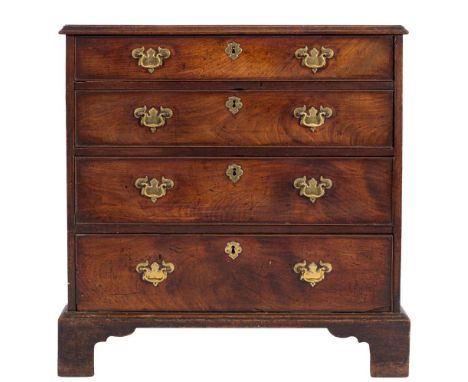 A George III mahogany rectangular chest:, the top with a moulded edge, containing four long graduated drawers with brass drop