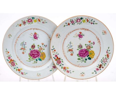 A Chinese famille rose charger: painted with a central scroll panel of peonies and other flowers on a floral diaper ground,  