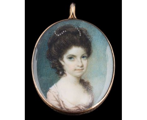 Circle of Samuel Shelley [1750-1808]-A miniature portrait of a lady, said to be Mrs Warnaby,:-head and shoulders, with blue e