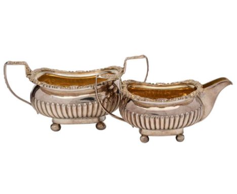 A late George III silver cream jug and matching sugar basin, maker Sarah & William Blake, London, 1818: of barge-shaped outli