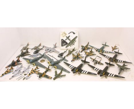 Planes: A collection of assorted unboxed model planes to include varying military examples. Approx. 25. Generally appear in g
