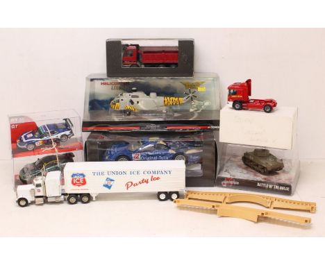 Diecast: A collection of assorted boxed diecast to include: Mercedes-Benz Tipper and CLK-GTR, four framed and glazed pictures