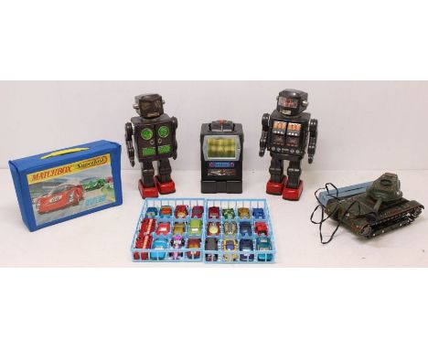 Tinplate: A collection of four Japanese tinplate toys to include: M-40 Tank, Attacking Martian Robot, as well as another robo