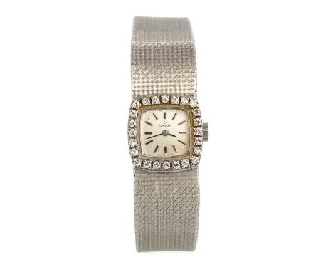 OMEGA, EIGHTEEN CARAT WHITE GOLD MANUAL WIND WRIST WATCH  the cushion shaped dial with baton hour markers, diamond bezel, 16m