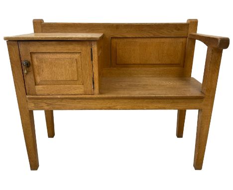 20th century Arts & Crafts design light oak telephone table, panelled back, fitted with panelled cupboard, on square tapering