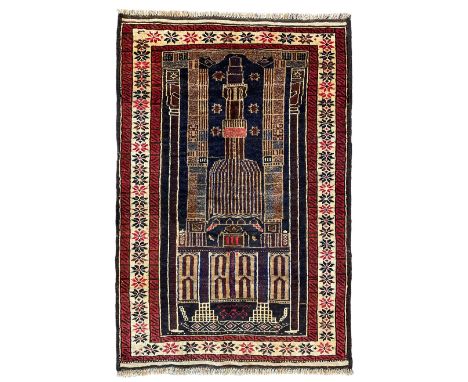 Baluchi ivory and indigo ground prayer rug, the field with architectural design surrounded by a guarded border with repeating