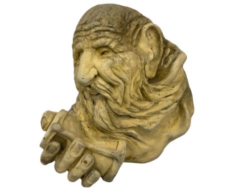 Classical design cast stone wall plaque or mask, in the form of the Greek Titan of time Cronus (Kronos) holding an hourglass 