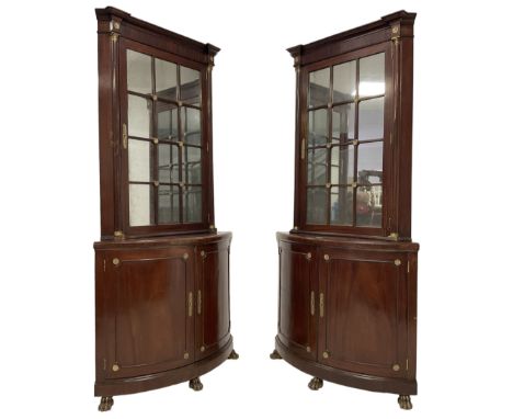 Pair of French Empire design corner cabinets, the straight-front upper section with canted corners and applied half-column pi