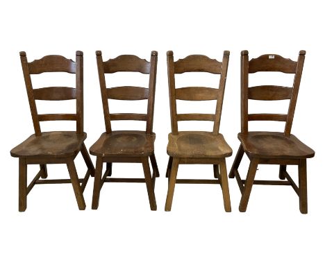 Set four early 20th century solid oak dining chairs, high ladder back over saddle shaped seat, raised on square supportsDimen