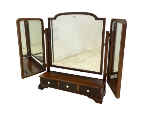 Early 20th century mahogany triple mirror back, the hinged frames with bevelled plates, base fitted with three small drawers 