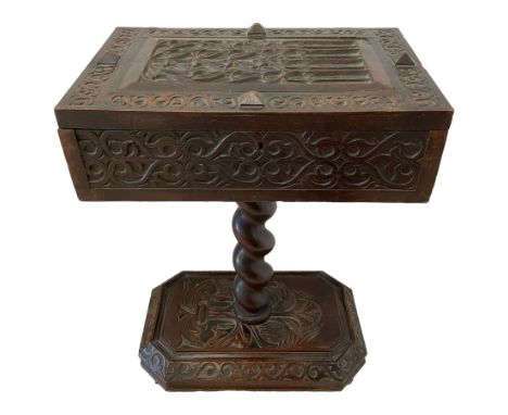 Jacobean Revival - 19th century heavily carved oak tea caddy, the box with panelled hinged lid carved with Gothic tracery wor