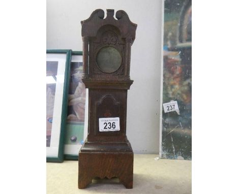 A 19/20th century Grandfather clock pocket watch stand with inlaid door panel.