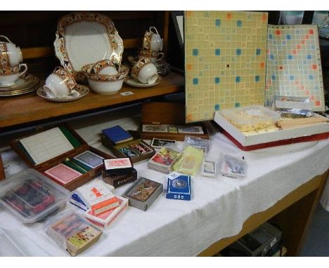 A mixed lot of cards, including playing and collectors