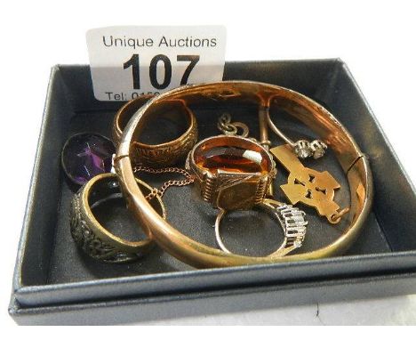 A selection of vintage rings and rolled gold bangle
