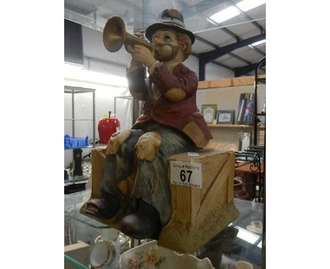 A pottery trumpet playing musical tramp automaton (plays when the saints go marching in)