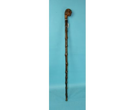 A walking stick, probably blackthorn, with carved figure of a man with hooked nose, carved in top 'S S Hilda, 1905', commemor