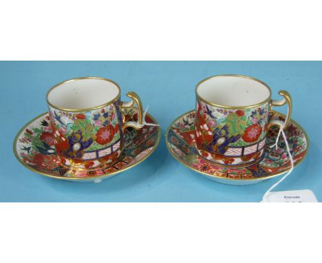 A pair of Barr, Flight and Barr, Worcester, Imari pattern cans and saucers, impressed marks, saucers 12.5cm diameter.