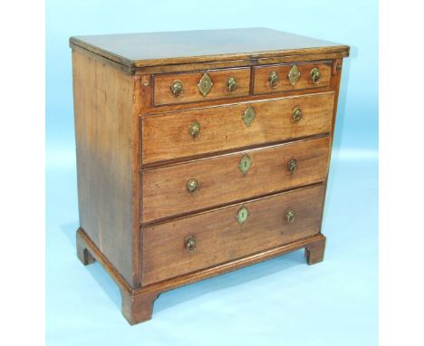 A Georgian mahogany bachelor's chest, the fold-over top above two short and three long moulded drawers, on bracket feet, 73cm