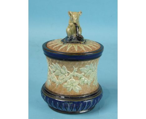 A Doulton Burslem stoneware tobacco jar and cover of waisted form, decorated overall in blue and pale green colours, the lid 