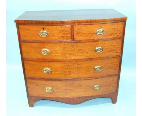 A Late-Georgian figured mahogany bow-fronted chest of two short and three long cockbeaded drawers, on bracket feet, 106cm wid