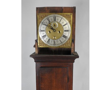 An 18th century oak eight day longcase clock, the 12 inch square brass dial signed Tho Baker, Portsmouth, with centred subsid