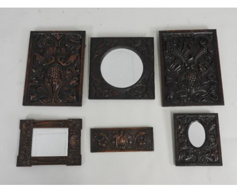 Two 19th century oak Arts and Crafts panel each of leaf and berry design, 48.5cm x 35.5cm along with three 19th century oak f
