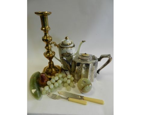 A pair of brass candlesticks, a silver plated teapot, a small quantity of ivorine handled cutlery, decorated models of fruit,