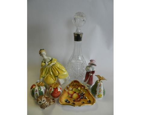 A group of multi colour porcelain models of fruit, a pressed glass decanter with white metal colour, a further cut glass deca