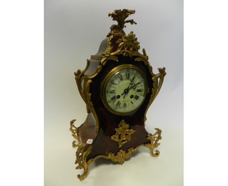 A French gilt-metal mounted Boule-style mantel clock, the typical 8 day movement striking on a coil gong.